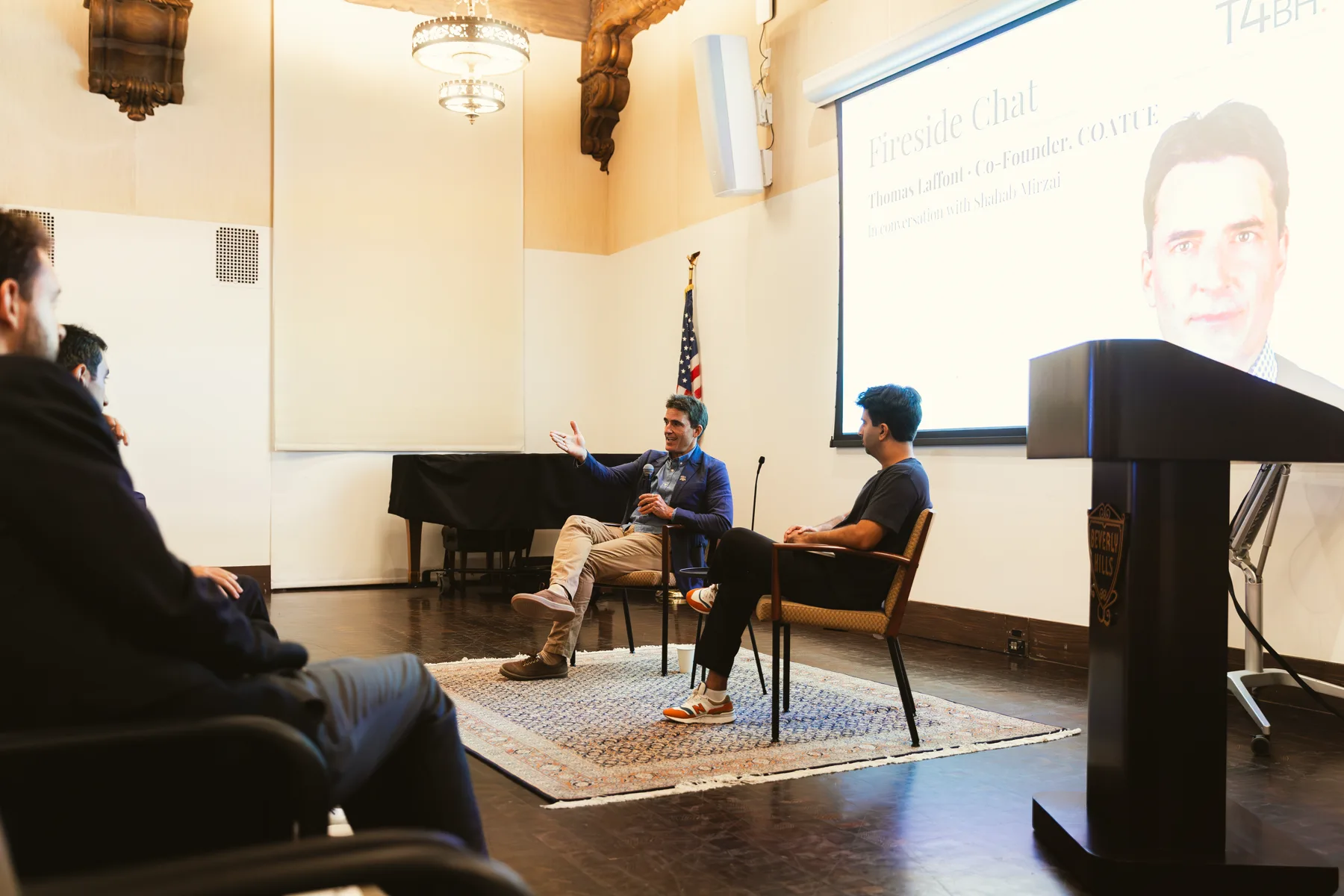 Thomas Laffont speaking with Shahab Mirzai on stage
