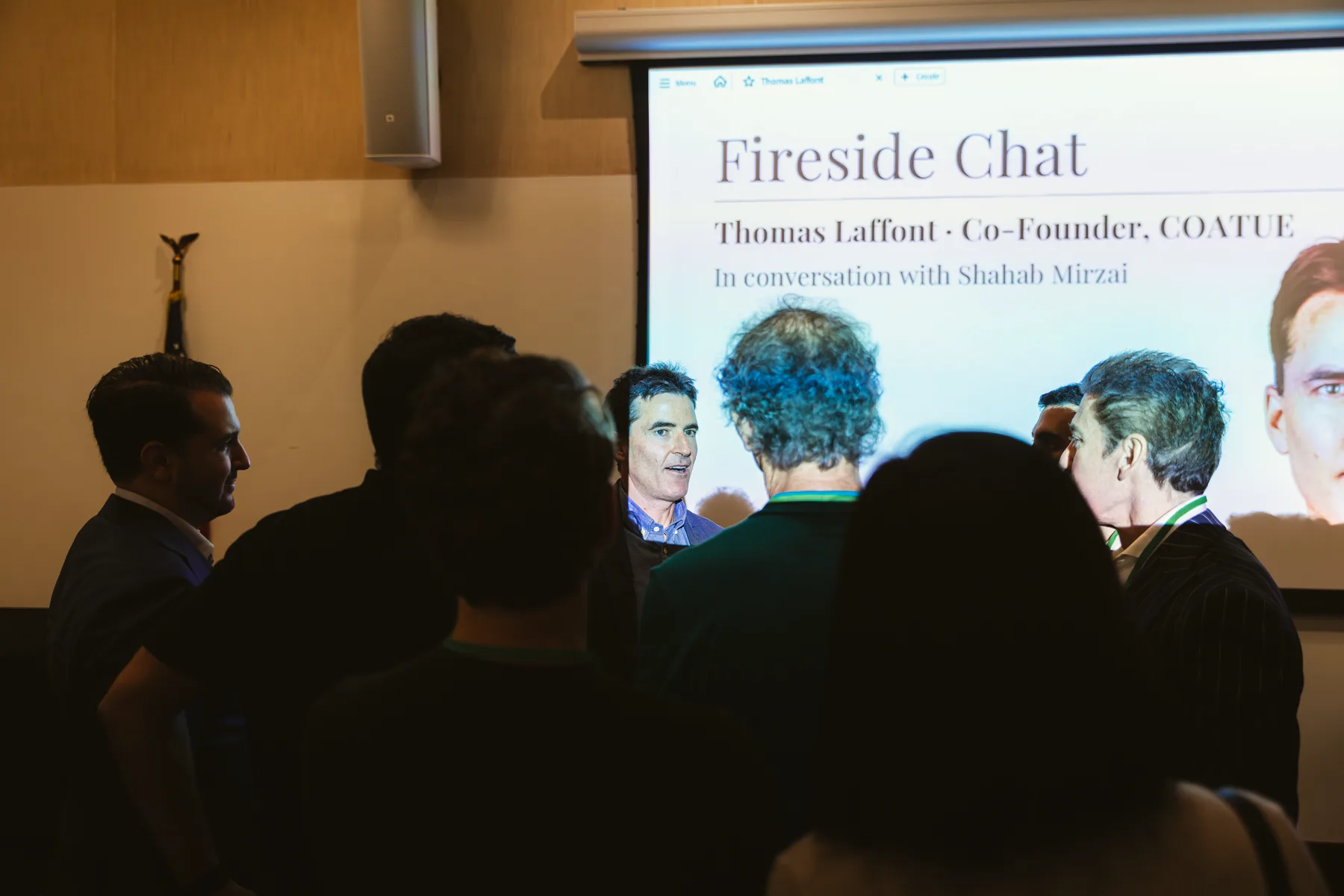 Thomas Laffont speaking with guests after the Fireside Chat
